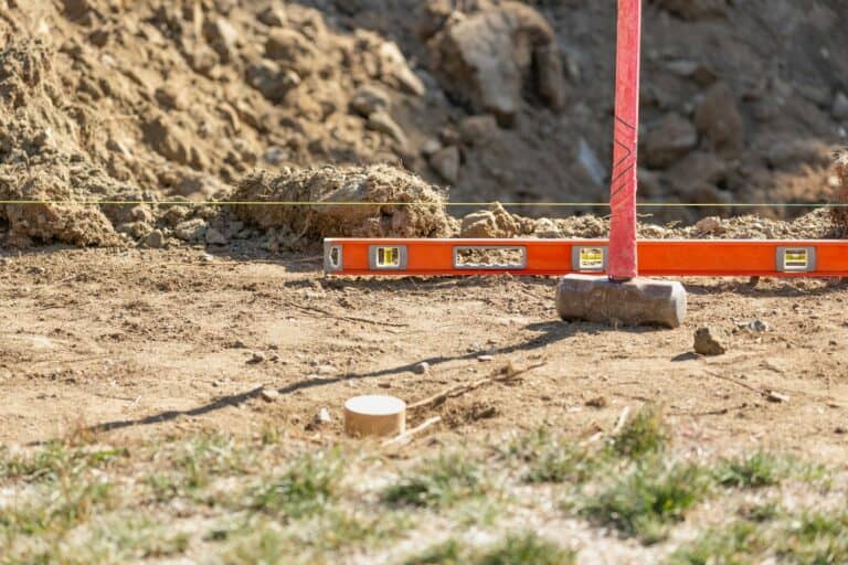 Guide Line, Level and Sledge Hammer At Construction Site